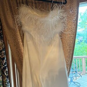 Brand new white jumpsuit, size small, brand is untamed petals